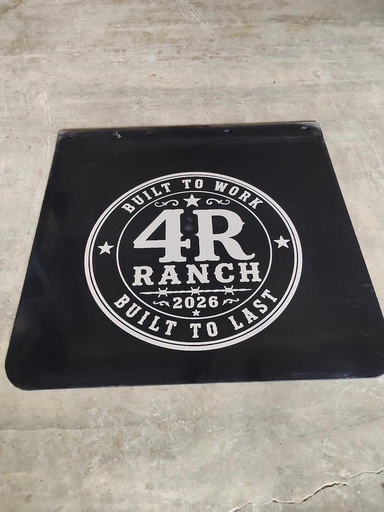 Black mud flap with white circular logo reading 4R Ranch 2026, Built to Work Built to Last